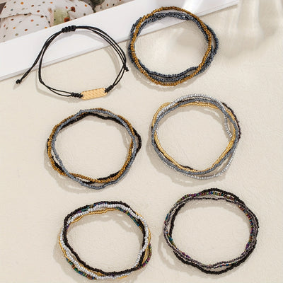 18-teiliges Glasperlenarmband-Set – Schwarz & Gold für Urlaub & Party